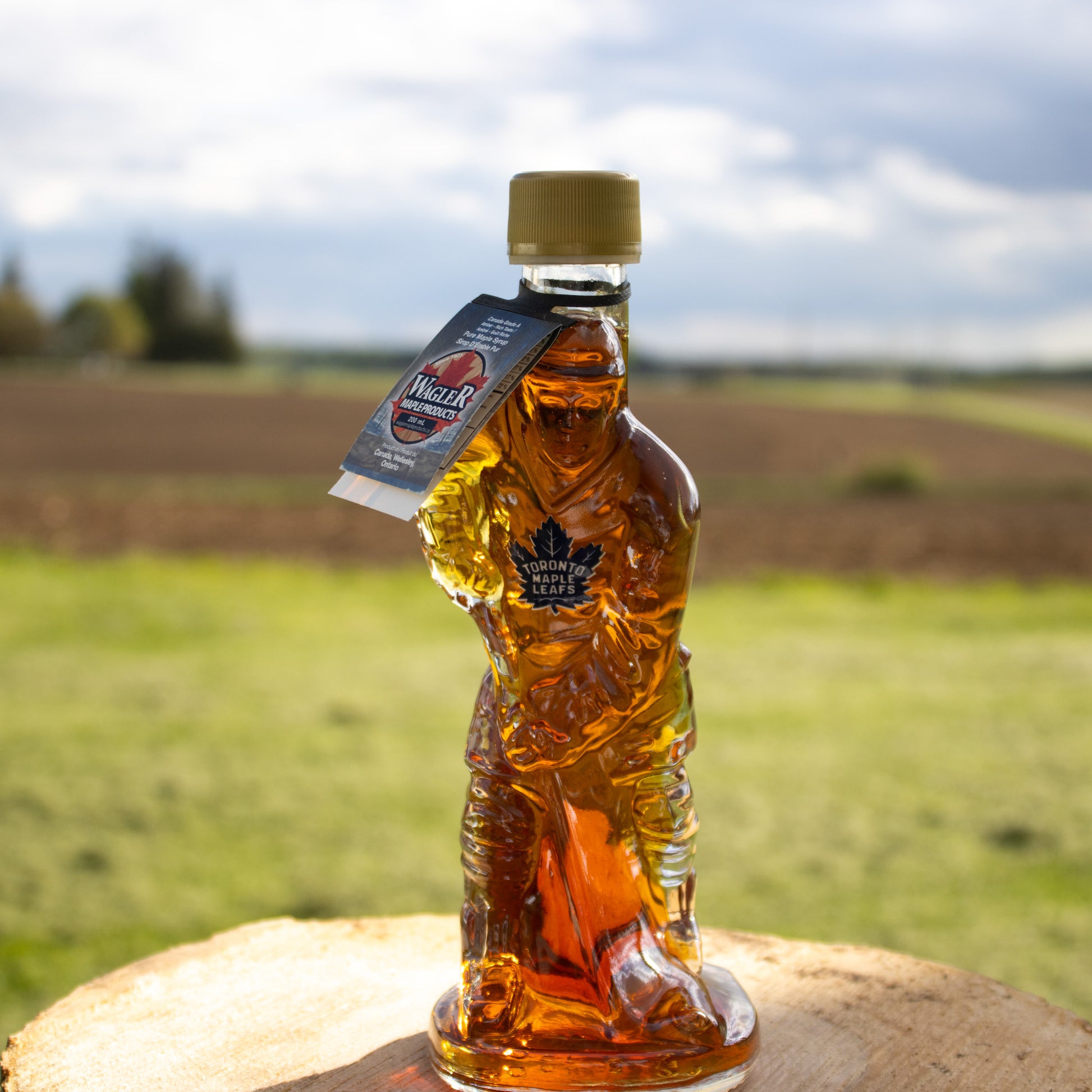 Glass NHL Toronto Maple Leafs hockey player bottle filled with pure Ontario maple syrup that makes an amazing gift