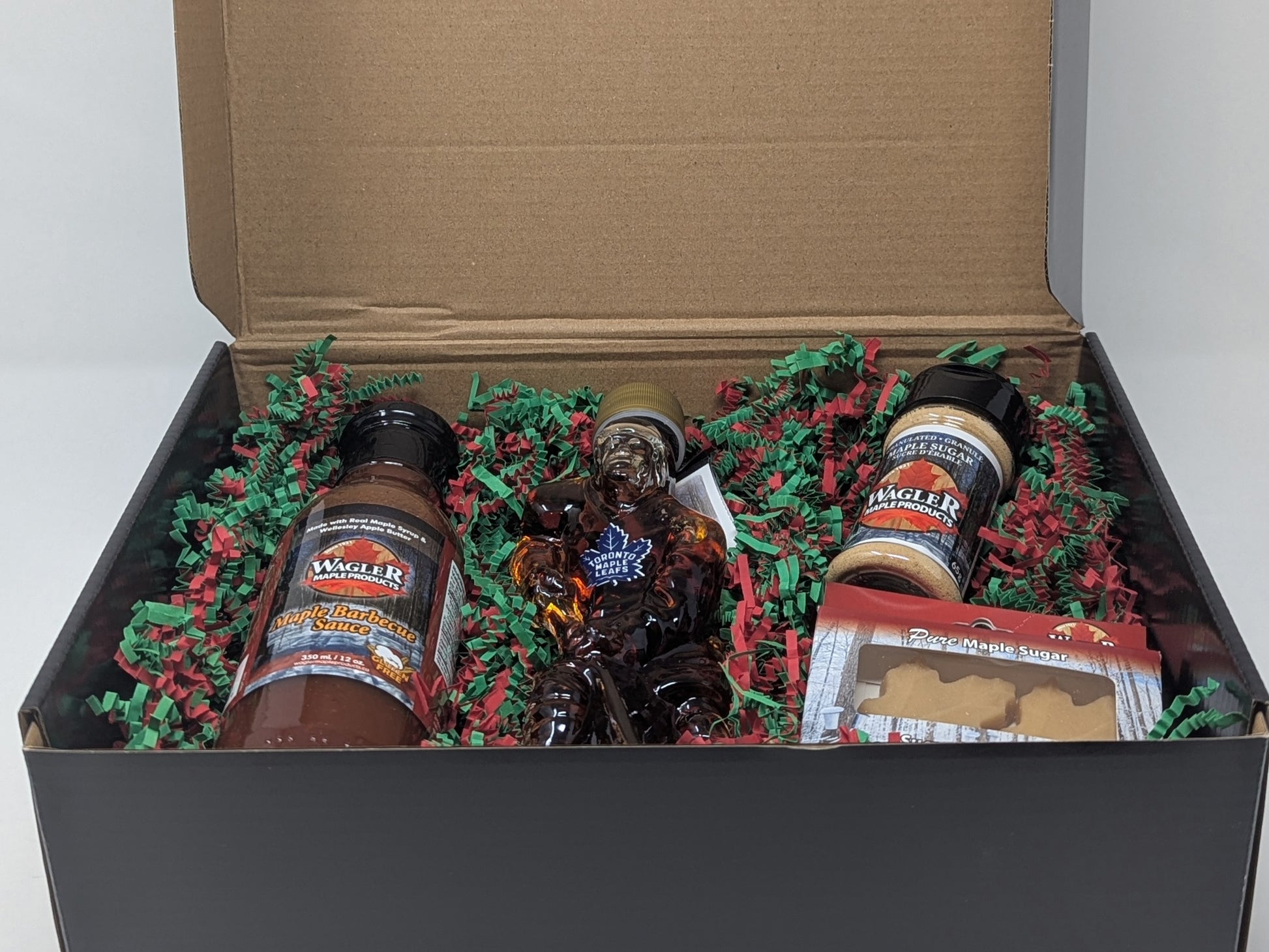 Holiday gift box with Wagler Maple Products maple syrup, bbq sauce, maple sugar, and maple sugar candy