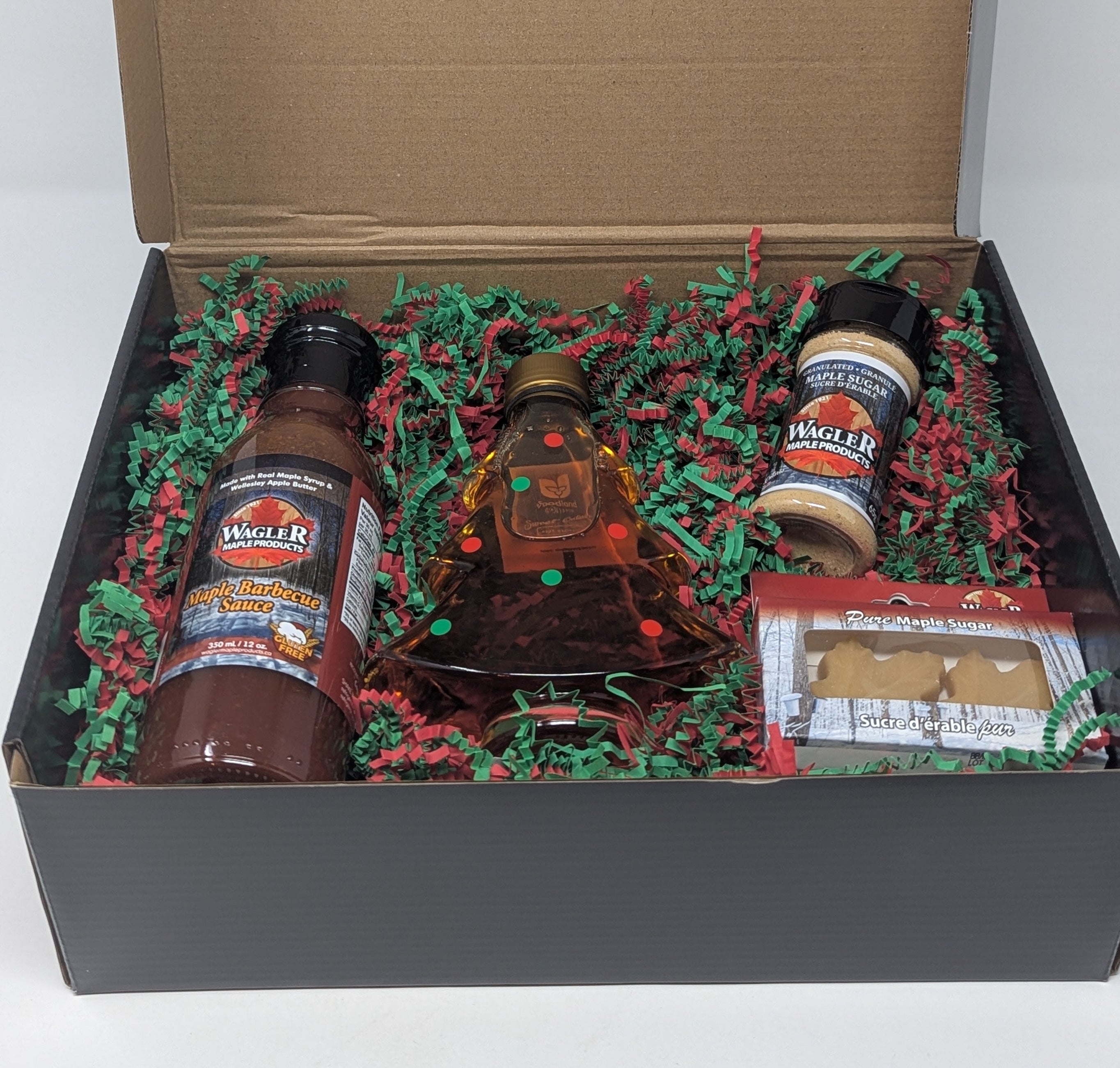 Gift box with pure Ontario maple syrup in festive Holiday Tree glass bottle and other maple treats
